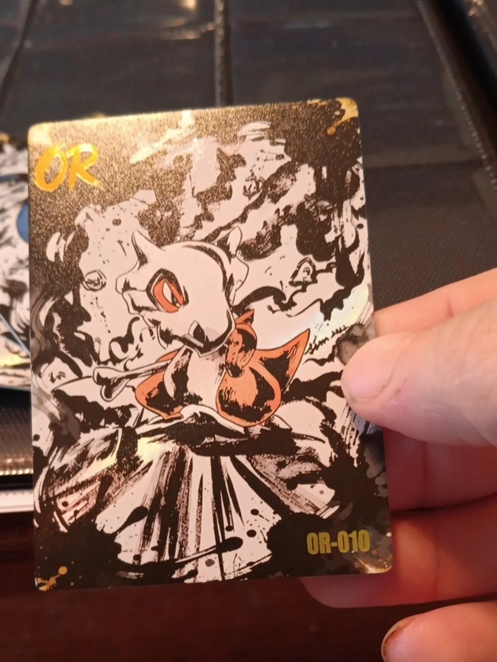 OR-010 Holographic Cubone Illustration Card - Black, White, Orange Accents
